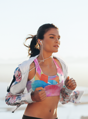 sports-bra-mockup-featuring-a-woman-running-at-a-stunning-landscape-34870-r-el2