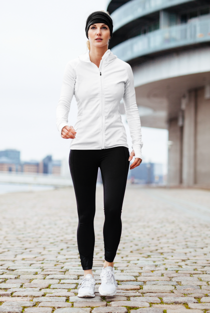 sublimated-hoodie-mockup-of-a-woman-in-activewear-walking-by-a-building-41368-r-el2